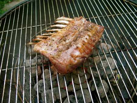 After applying salt and pepper on the lamb, sear it on a hot grill, 